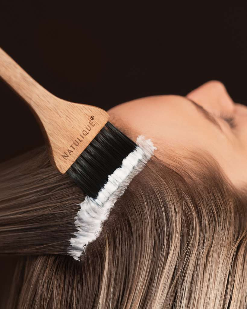 Scalp brush treatment application